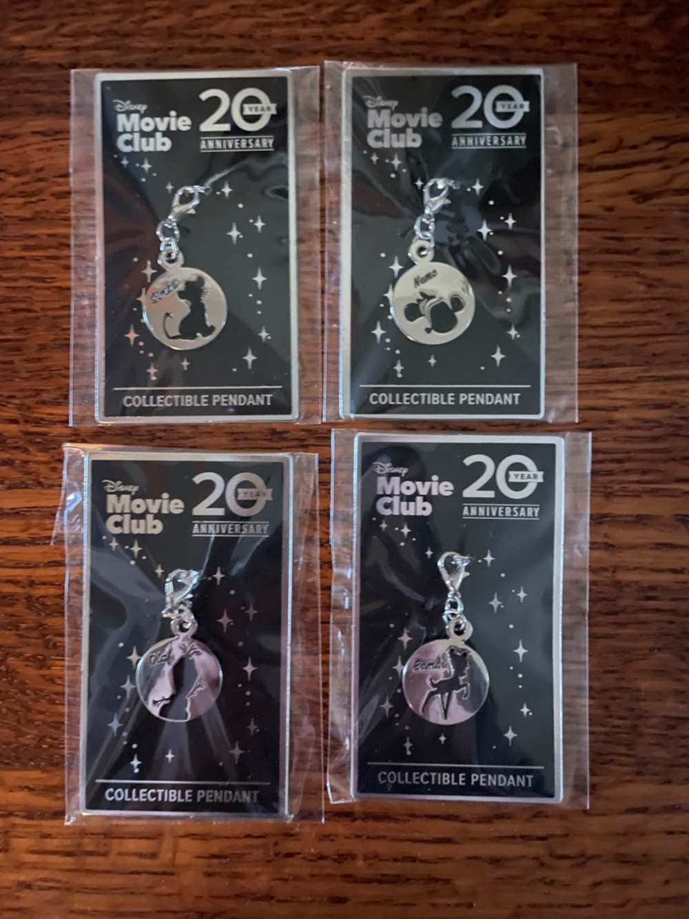 Disney 20th Anniversary Silver Movie Club Collectible Pendant Set - 4 Pack